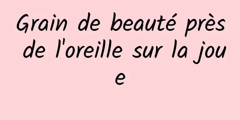 Grain de beauté près de l'oreille sur la joue